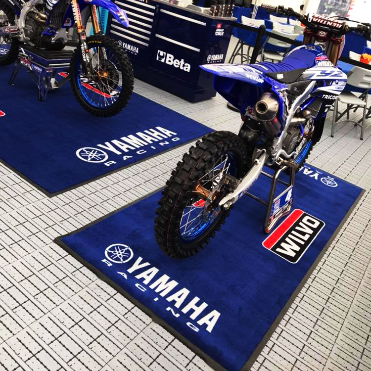 SHYNGO professional motorcycle pit mat with custom team logo printing for garage and racing.